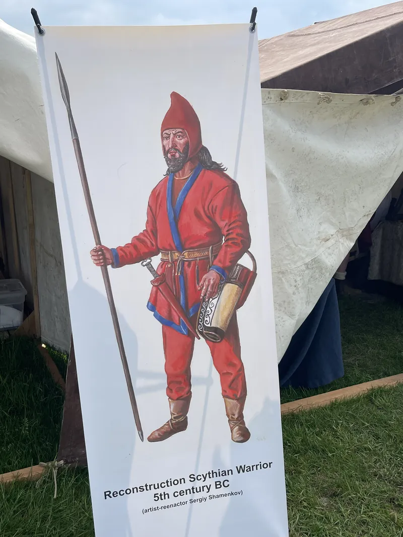 Banner reconstructing a Scythian warrior of the fifth century BC, in red patterned dress with a spear