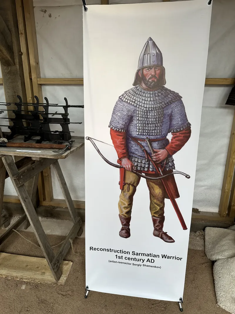 The Sarmatian warrior banner standing beside the weapons trestles